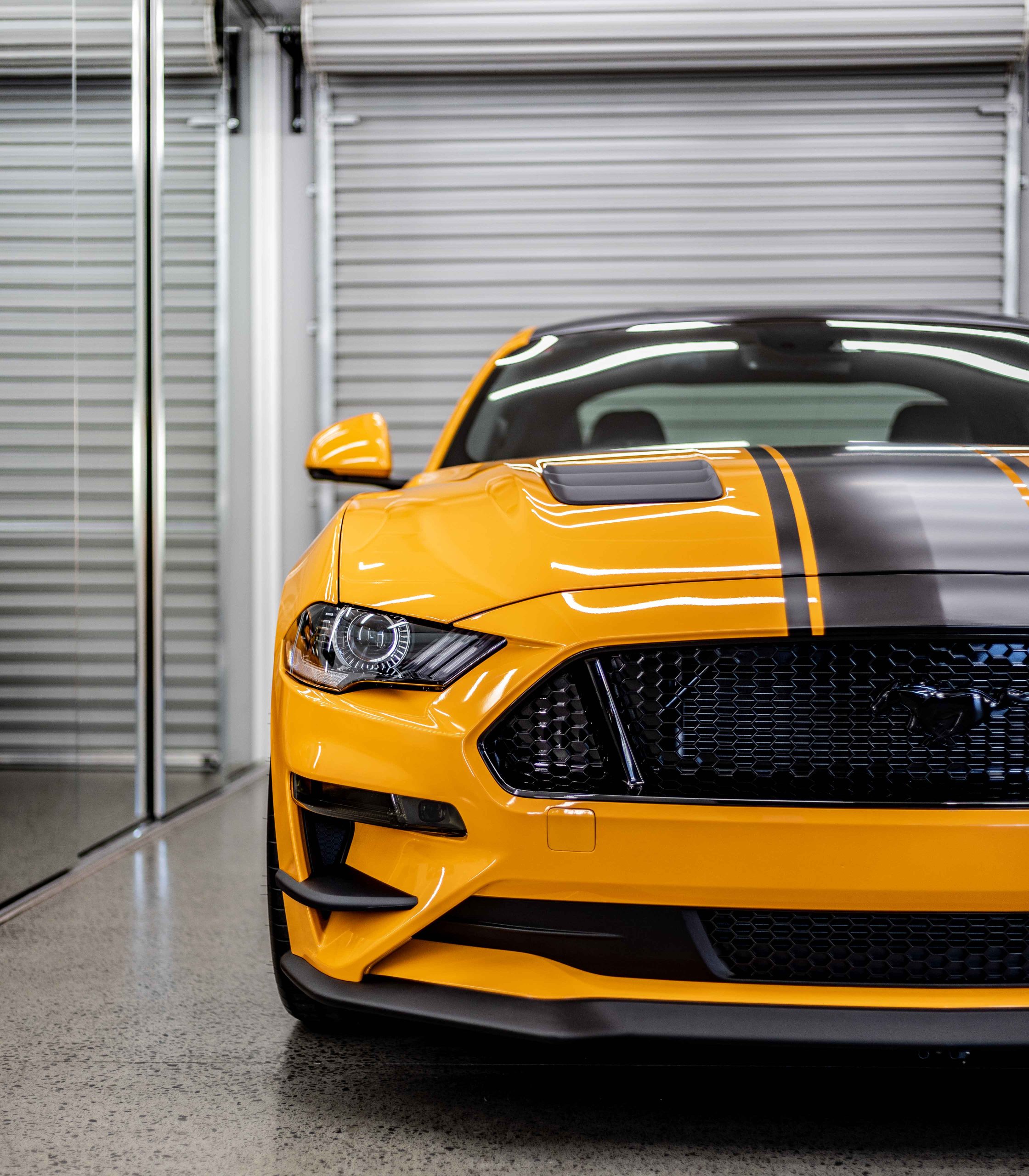 Yellow Ford Mustang with ceramic coating protection by Always Dry
